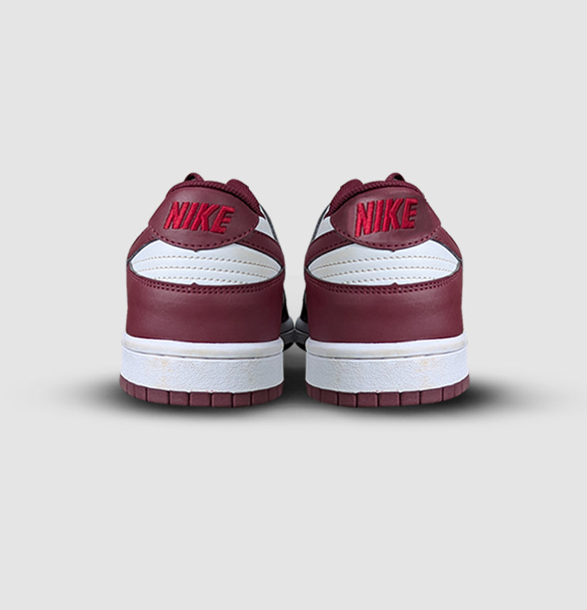 Nike Dunk Low Retro in White & Team Red – unisex sneakers blending vintage basketball heritage with timeless streetwear appeal.